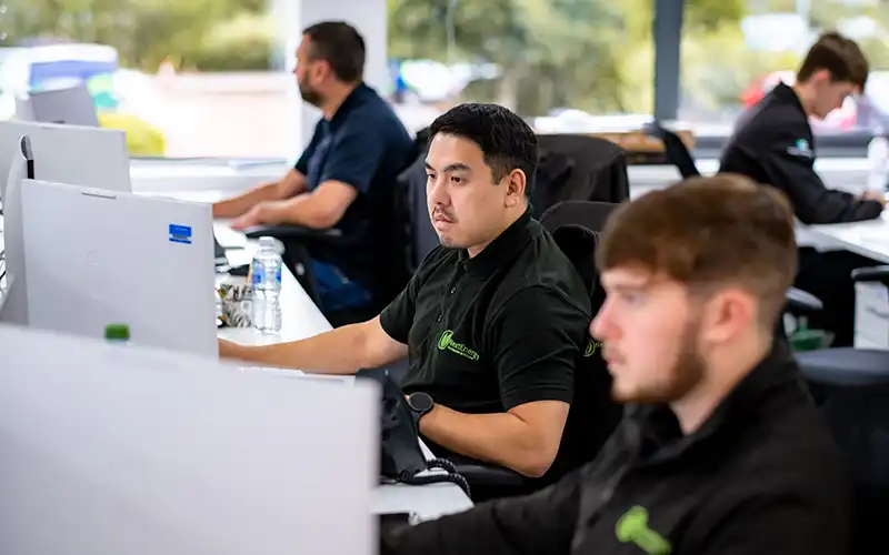 Next Energy employees working at desks.