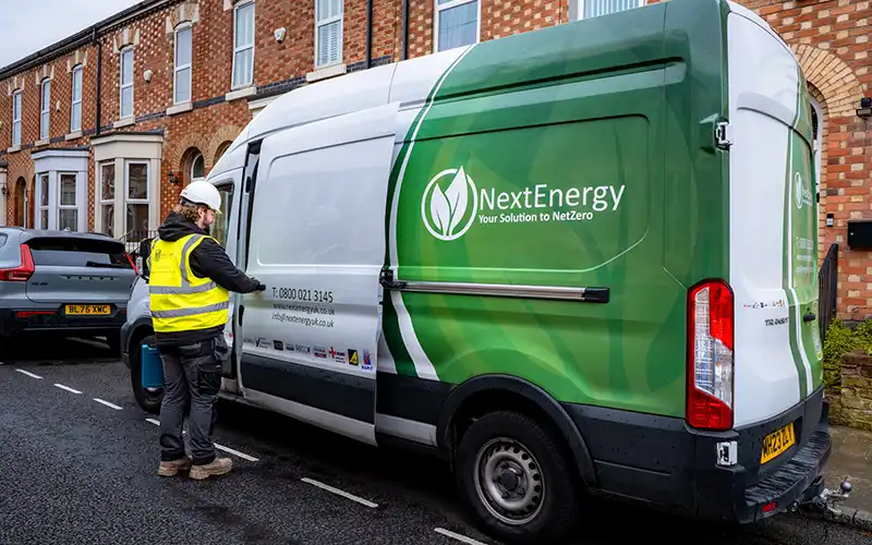Next Energy van parked on the street.